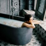 woman sitting in bathtub