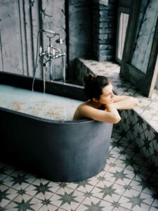 woman sitting in bathtub