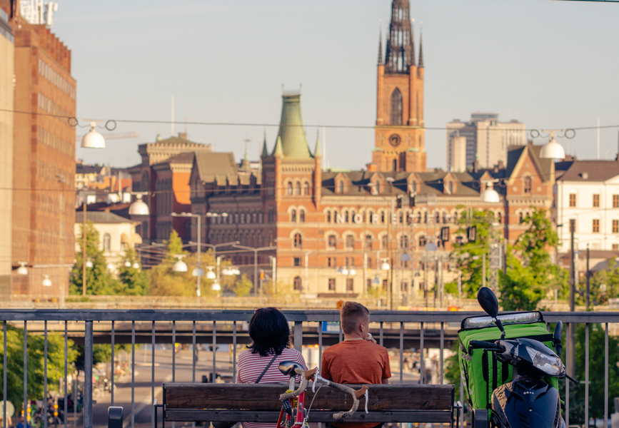 couple sitting on a bench in stockholm sweden