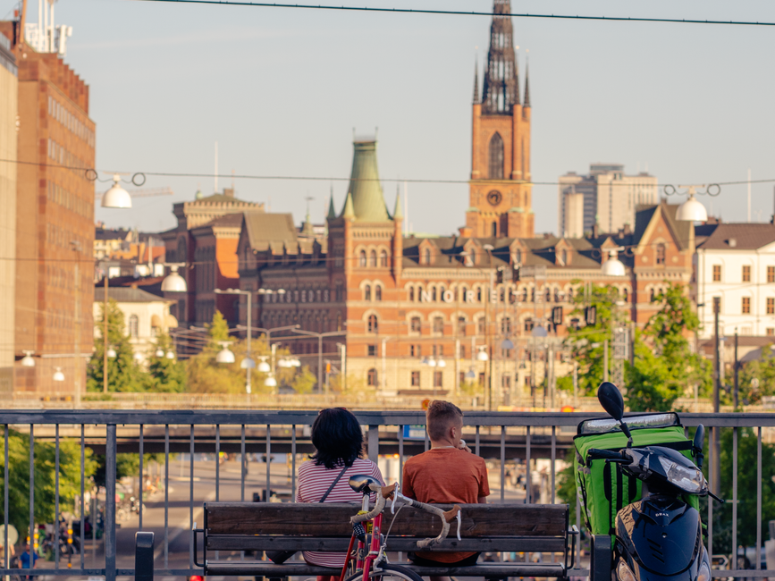 couple sitting on a bench in stockholm sweden
