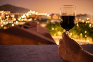 photo of person holding wine bottle