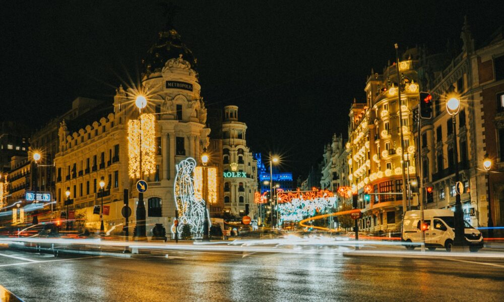 night view of gran via in madrid decorated for holidays