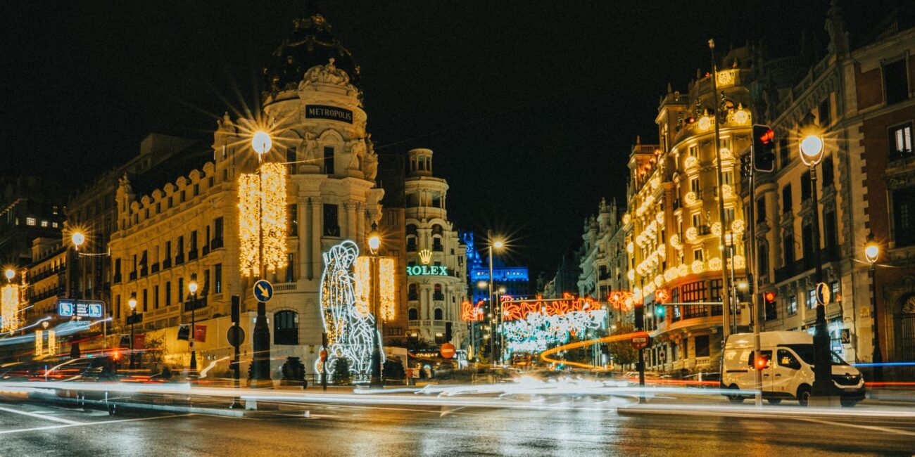 night view of gran via in madrid decorated for holidays