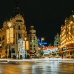 night view of gran via in madrid decorated for holidays