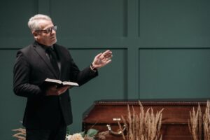 a man in black suit