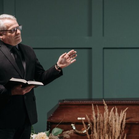 a man in black suit