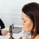 a lady justice figurine on a desk