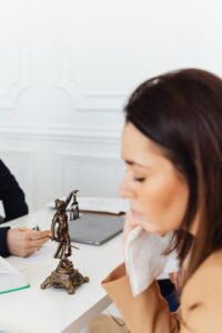a lady justice figurine on a desk